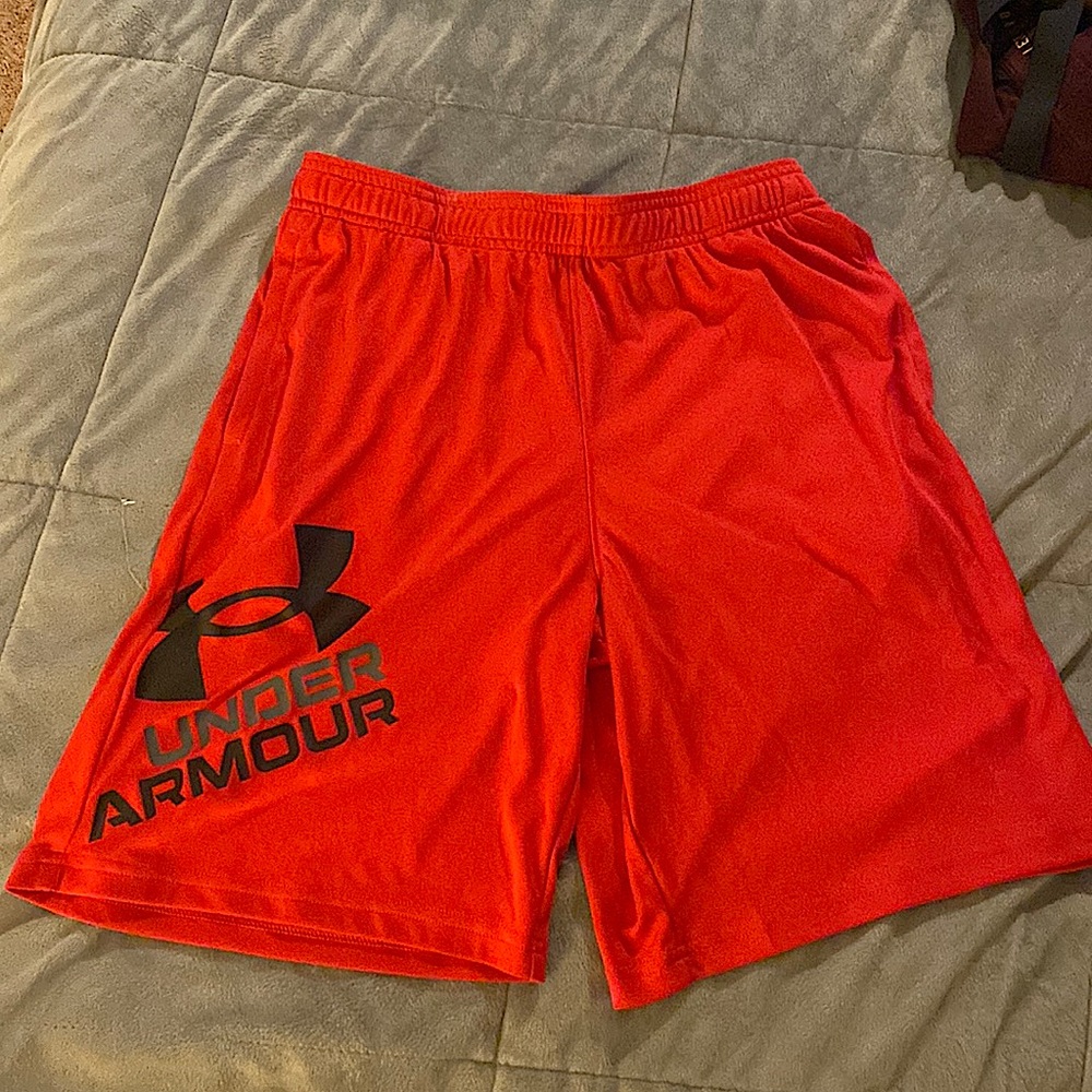 Under Armour youth XL red athletic shorts.